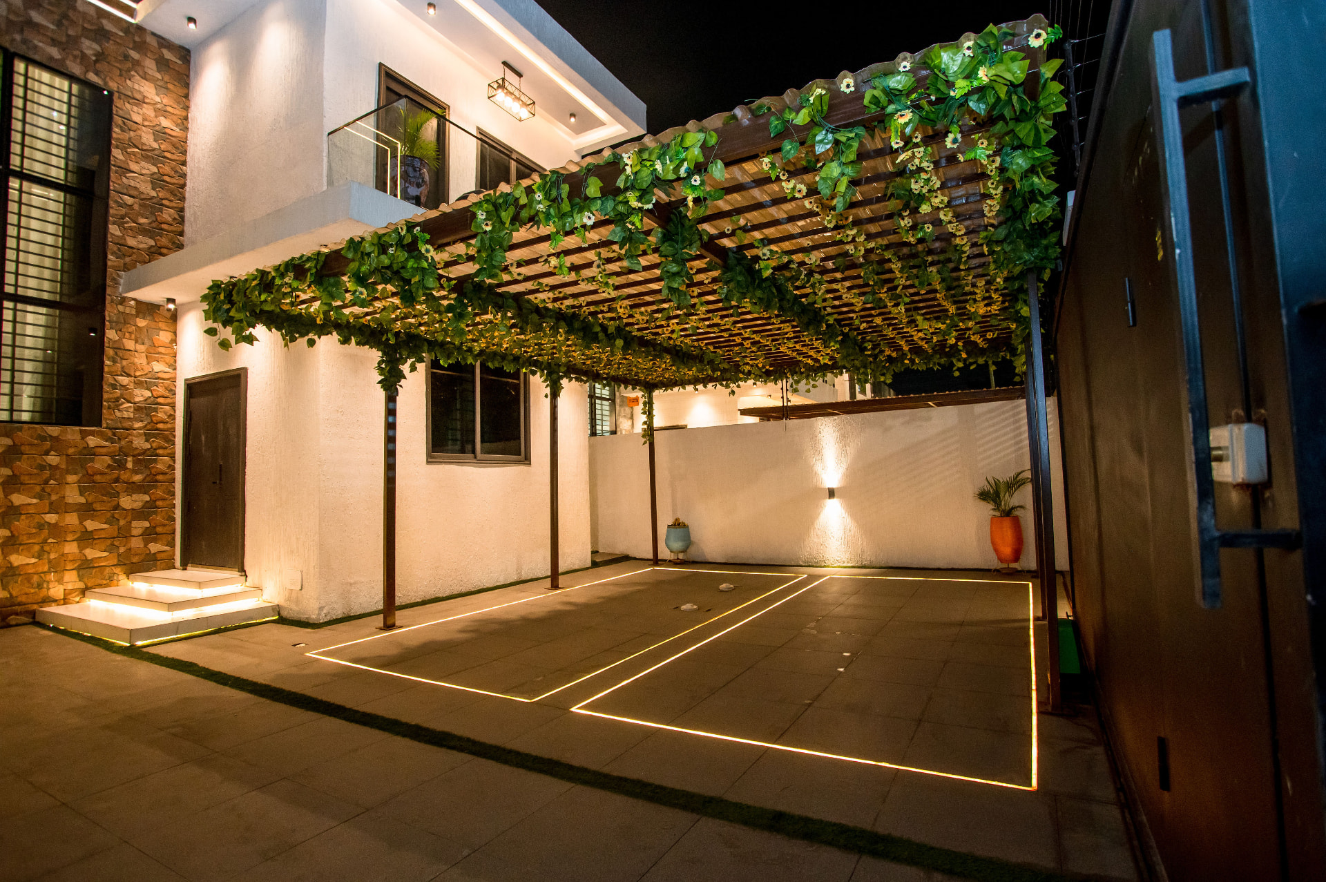 Pryse Enclave courtyard in Spintex, Accra, lit at night